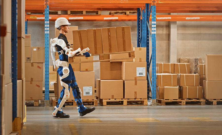 An image of a warehouse employee wearing IoT technologies