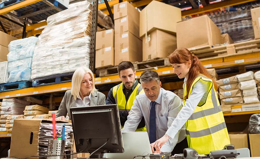 A warehouse manager having a meeting with warehouse operators