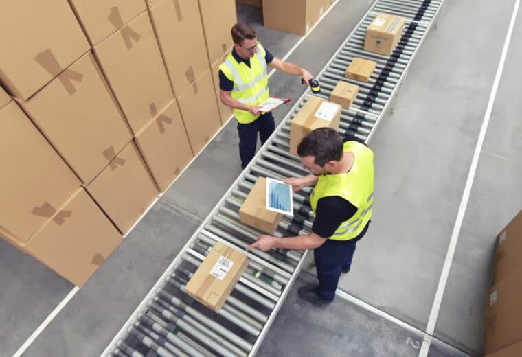 Warehouse employees processing packages
