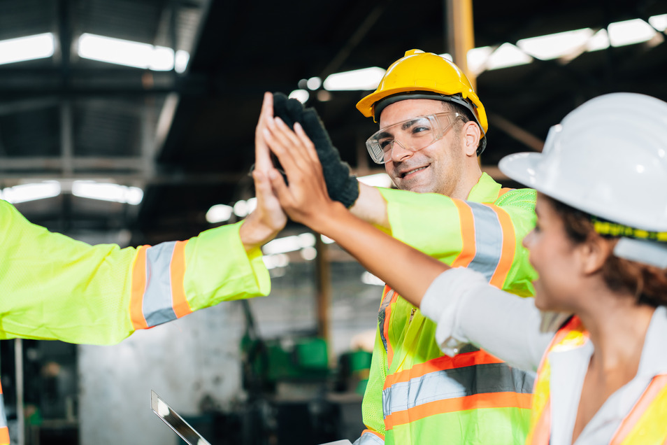 Warehouse employees supporting each other​