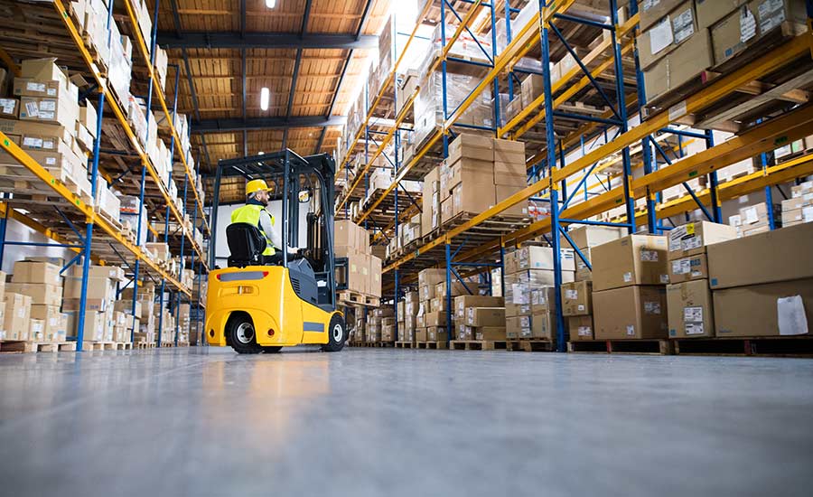 Predictive Maintenance - An image of a warehouse operator repairing a forklift