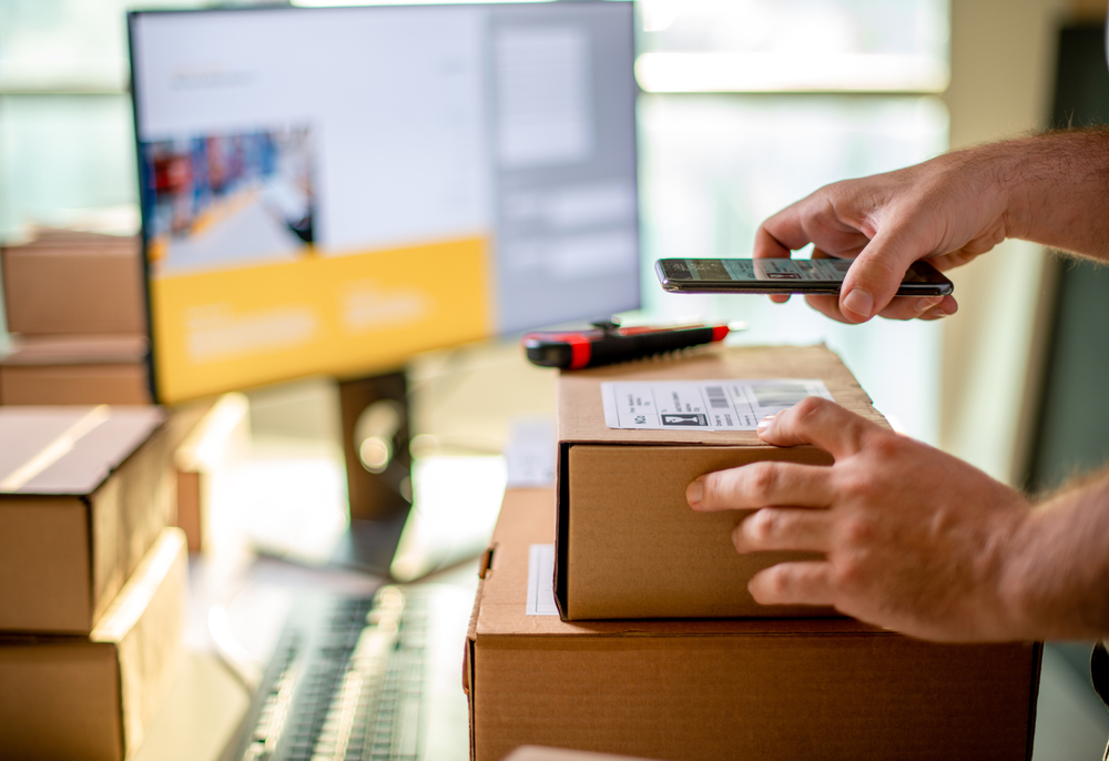 A warehouse employee scanning product details​