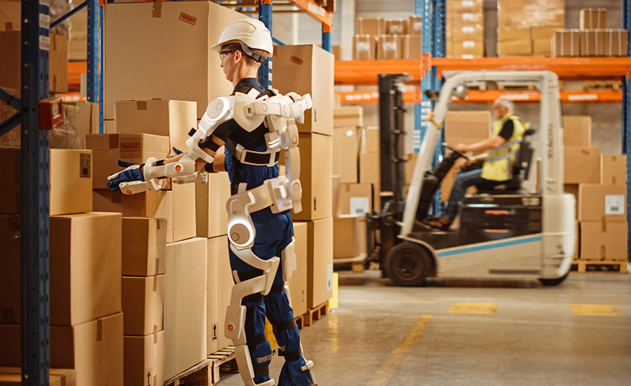 A warehouse employee wearing an exoskeleton