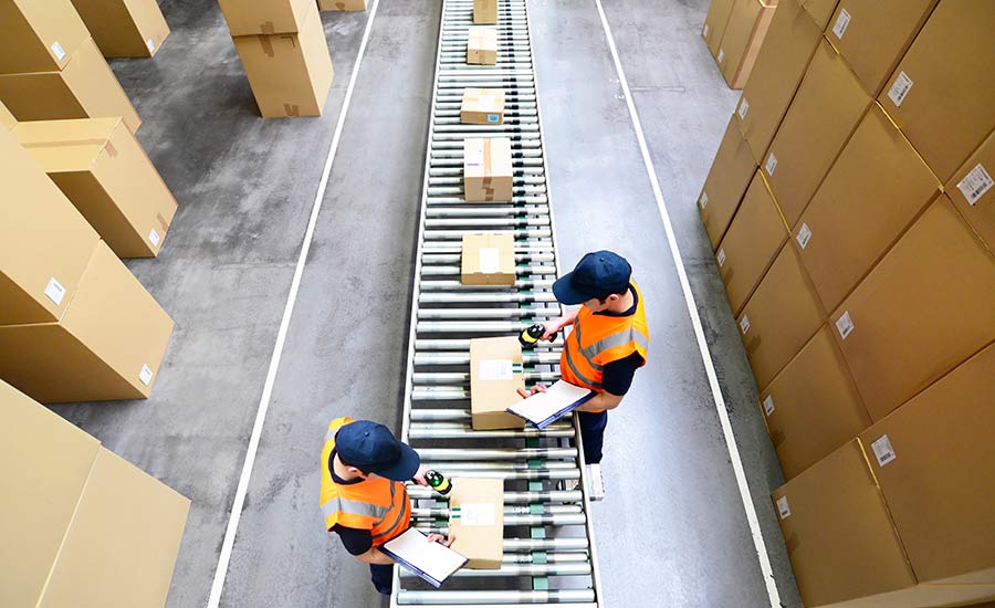 Warehouse employees labelling packages​