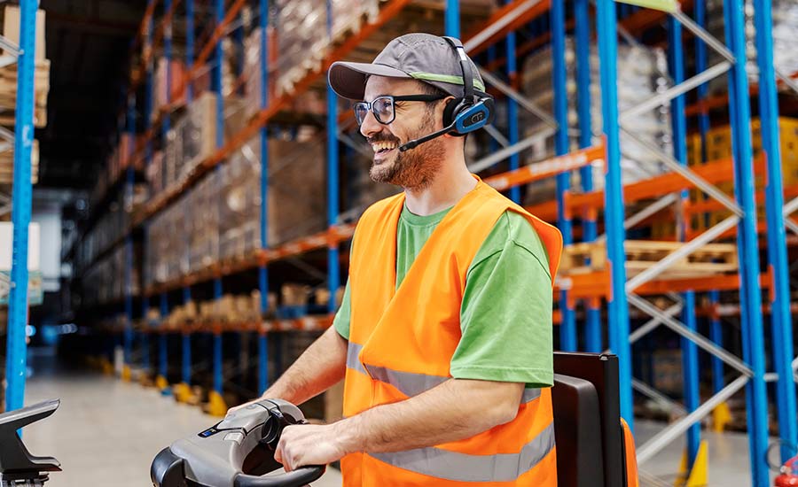 A warehouse employee using a voice picking system​