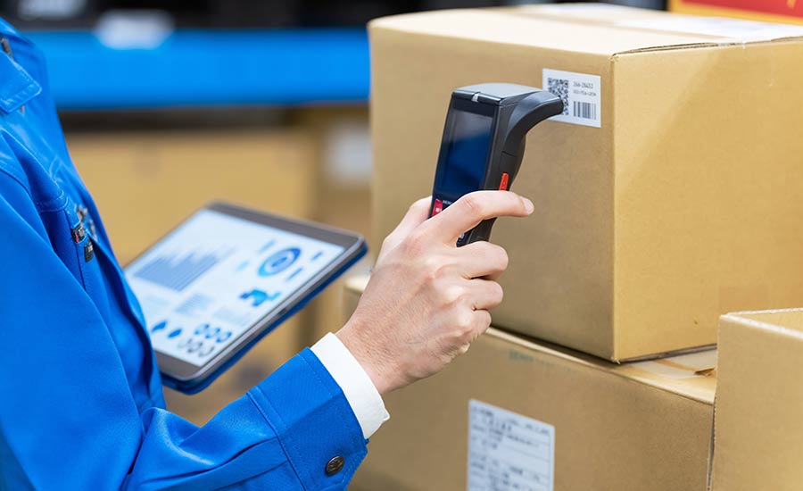 A warehouse operator using a barcode scanner and WMS​