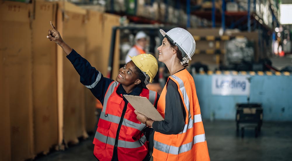 Two female warehouse employees​