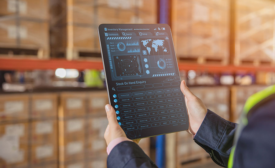 A warehouse employee using a WMS to calculate Inventory Turnover Ratio