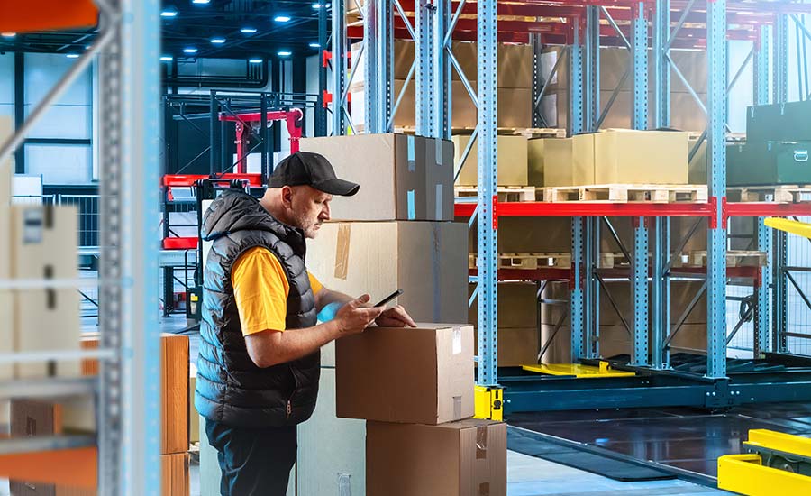 A warehouse employee checking inventory levels​