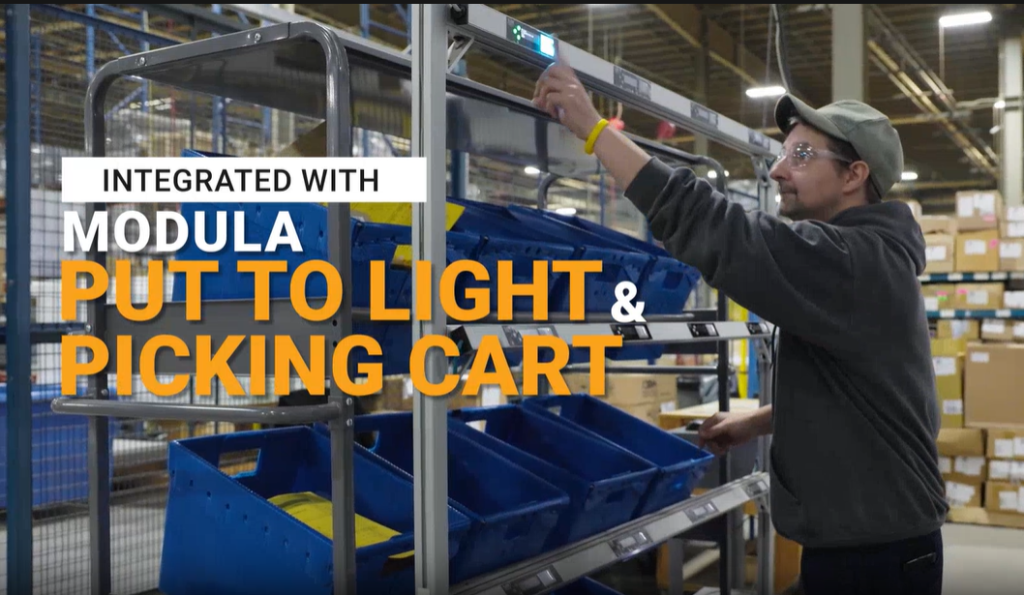 Jamesway operator using Modula Put to Light and Picking Cart during order fulfillment